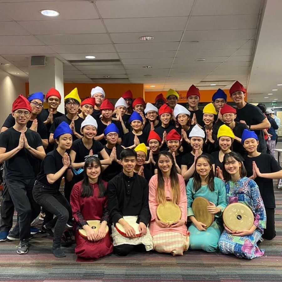 Dikir Barat group in colourful hats and traditional outfits